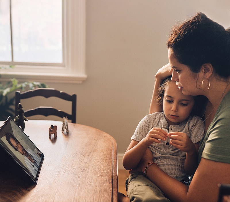 person at a telehealth appointment with a doctor from Urgent Care for Children