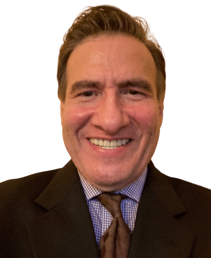 a man wearing a suit and tie smiling at the camera