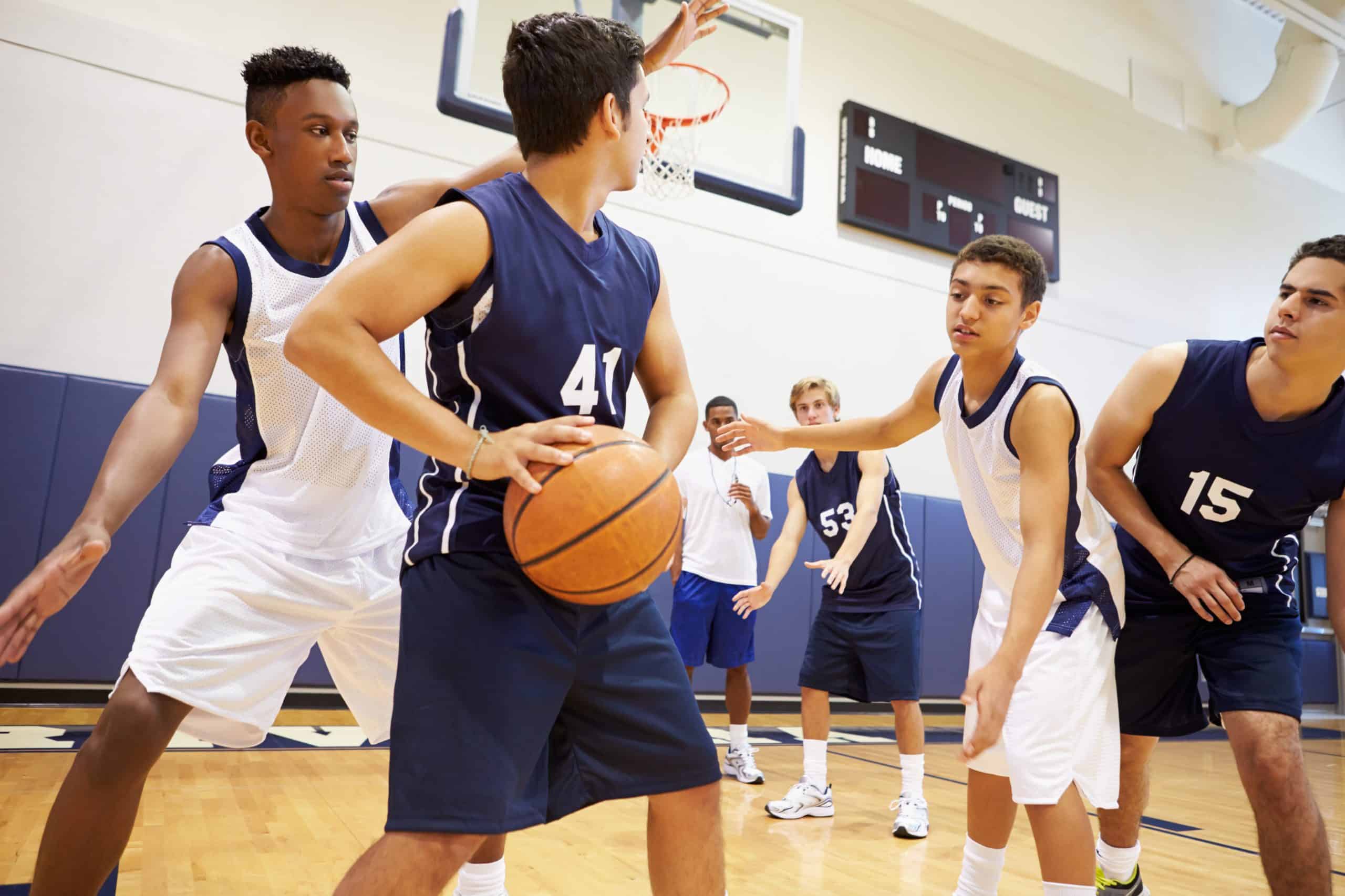 children playing basketball after getting sports camp physicals from Urgent Care for Children