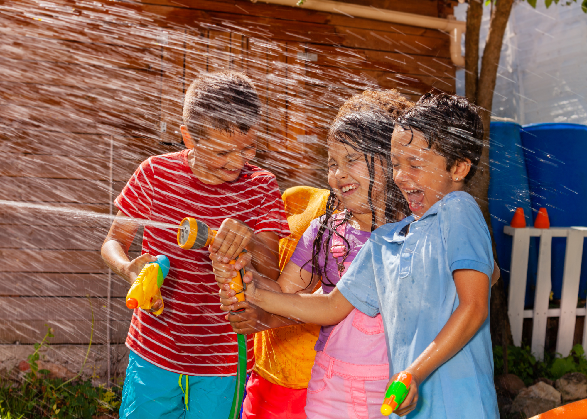 Kids playing with water toys after visiting Urgent Care for Children