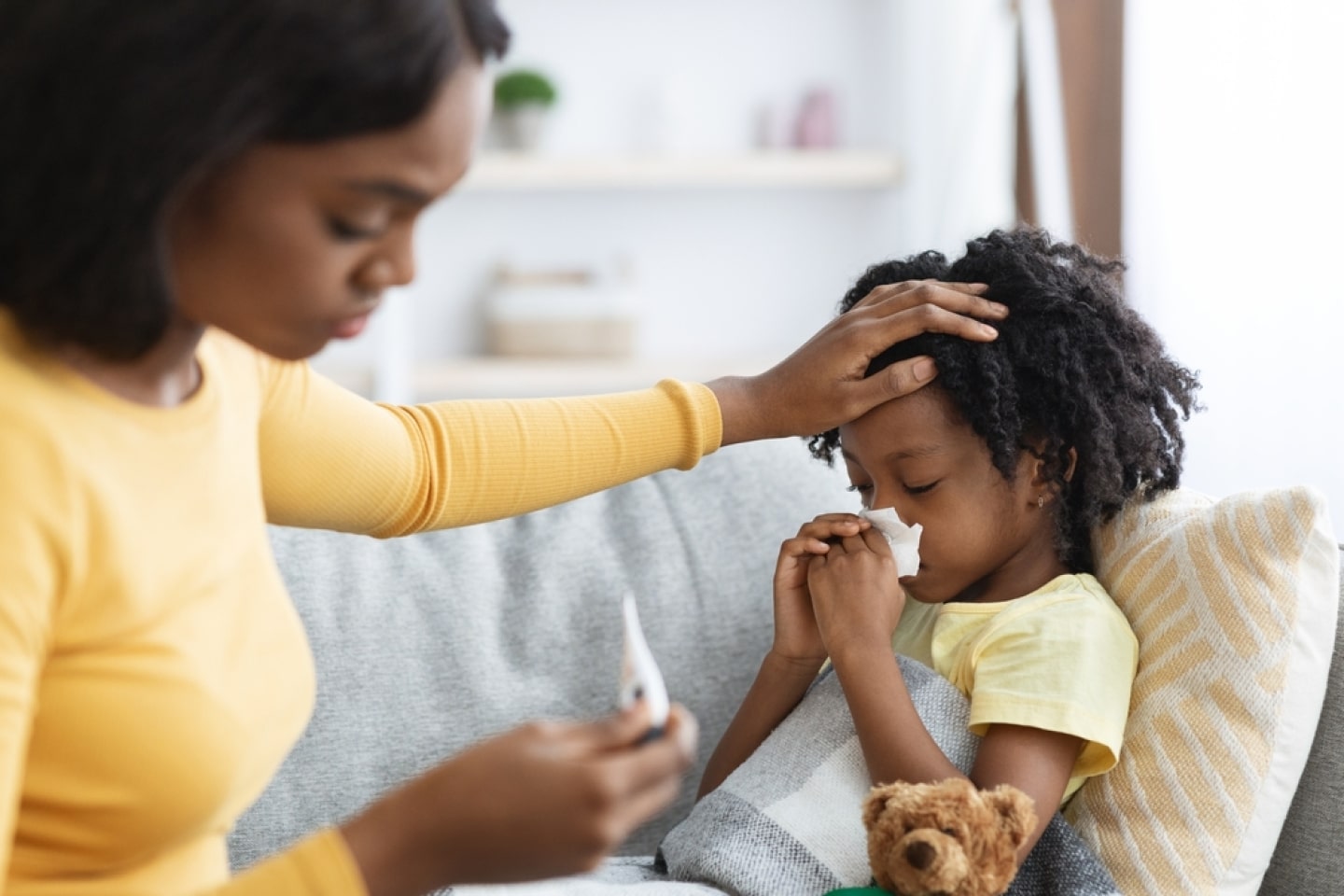 a woman holding a baby
